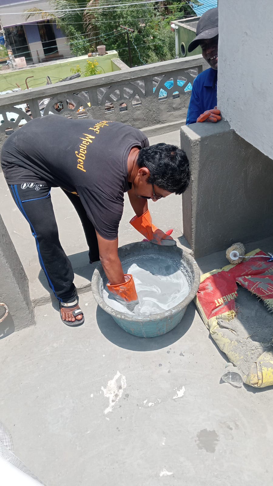 Waterproofing material application by technician